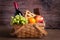 Purim basket with foods and wine on wooden table