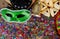 Purim jewish holiday with purim mask and purim a noisemaker on a vintage wood background with copys pace