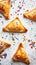 Purim Triangular cookies with ( hamantasch or aman ears ), colored candy for jewish holiday of purim celebration