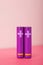 Purple AA batteries on a pink table