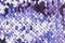 Purple abstract sequins sparkling background. Texture of sequins.