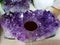 Purple amethyst stone isolated .Glossy violet texture of natural amethyst.