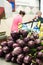 Purple aubergines heap in market