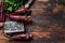 Purple beetroot on a cutting board. Dark wooden background. Top view. Copy space