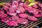 purple beetroot slices sizzling on a grill