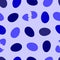 purple, blue, dark blue eggs whole and cracked in half on a light lilac background