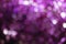 Purple bokeh lights background, colorful glitter defocused