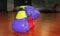 purple boxing gloves on a gym floor