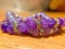 Purple bracelets on wood