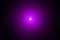 Purple bright flash of light in the dark. Motion blur. Staburst