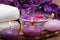 Purple candles and flowers in spa setting (1)