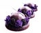 Purple chocolate desserts with shiny mirror glaze and blackberries