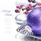 Purple Christmas ball on festive background