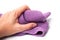 Purple cleaning towel in hand on white background