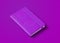 Purple closed notebook isolated on color background