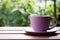 Purple coffee cup rests gracefully on a serene tabletop surface