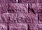 Purple color stylized brick wall pattern.