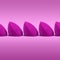 Purple cosmetic blending sponges in a row on a simple backdrop