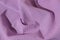 Purple cotton fabric textured background.