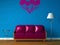 Purple couch, table and standard lamp