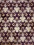 Purple, cream and brown graphical tribal design background