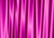 Purple curtain reflect with light spot on background.