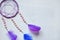 Purple dream catcher on white background. Dreamcatcher decoration accessory for bedroom, closeup photo. Workshop, hobby,