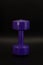 Purple dumbbell positioned vertically on a dark background