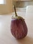 Purple eggplant with white stripes, pear-shaped on the kitchen t