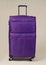 Purple Fabric suitcase isolated