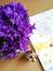 Purple flowers on march first with martisor and book