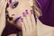 Purple French manicure and makeup.