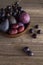 Purple fruit in a wooden bowl