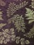 Purple and gold patterned velvet wallpaper