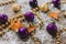 Purple and golden Christmas balls, dried mandarin stars and decorative gold beads