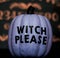 A Purple Halloween Pumpkin Saying Witch Please