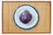 Purple head of red cabbage on a white plate with a blue rim