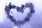 Purple heart under glass surface with water drops close. Valentines background, love, date concept