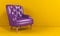 Purple leather armchair with quilted back and wooden legs in yellow interior, showroom, side view. Creative minimalistic interior