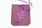 Purple linen pouch with embroidered flowers.