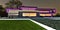 Purple luminous design elements of the suburban mansion constructed in minimalist style. Illuminated borders of the granite stone