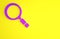 Purple Magnifying glass with search icon isolated on yellow background. Detective is investigating. Minimalism concept