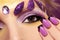 Purple makeup and nails.