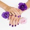 Purple manicure and flowers