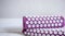 Purple massage acupuncture mat with pillow and white massage tips copy space