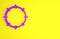 Purple Musical instrument percussion tambourine, with metal plates icon isolated on yellow background. Minimalism