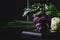 Purple organic fresh kohlrabi cabbage, summer harvest on brown kitchen table. selective focus