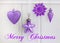 Purple ornaments and Christmas greeting