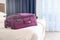 purple packed suitcase on the bed in hotel room