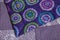Purple patterned quilt close up